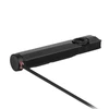 Lampe torche EDC plate noire Olight avec son câble de charge magnétique USB branché à l'arrière, fond blanc.