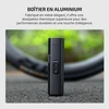 Lampe de vélo Olight avec boîtier en aluminium noir robuste et élégant posée sur le sol.