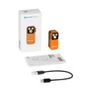 Lampe frontale Olight Oclip Pro orange avec boîte, manuel d'utilisation et câble de charge USB-C.